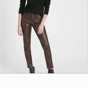 Banana Republic mid rise skinny ankle jean in black and gold  animal print. NWT